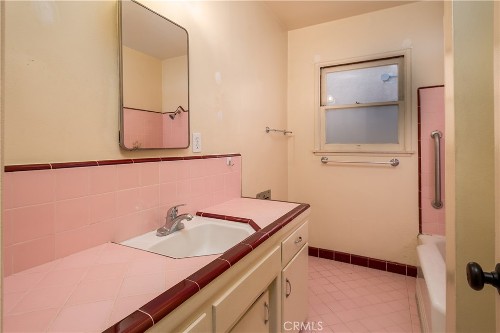 12817 Beverly Boulevard Whittier, CA 90601 - Photo 26 of 30 a bathroom with a sink and a mirror