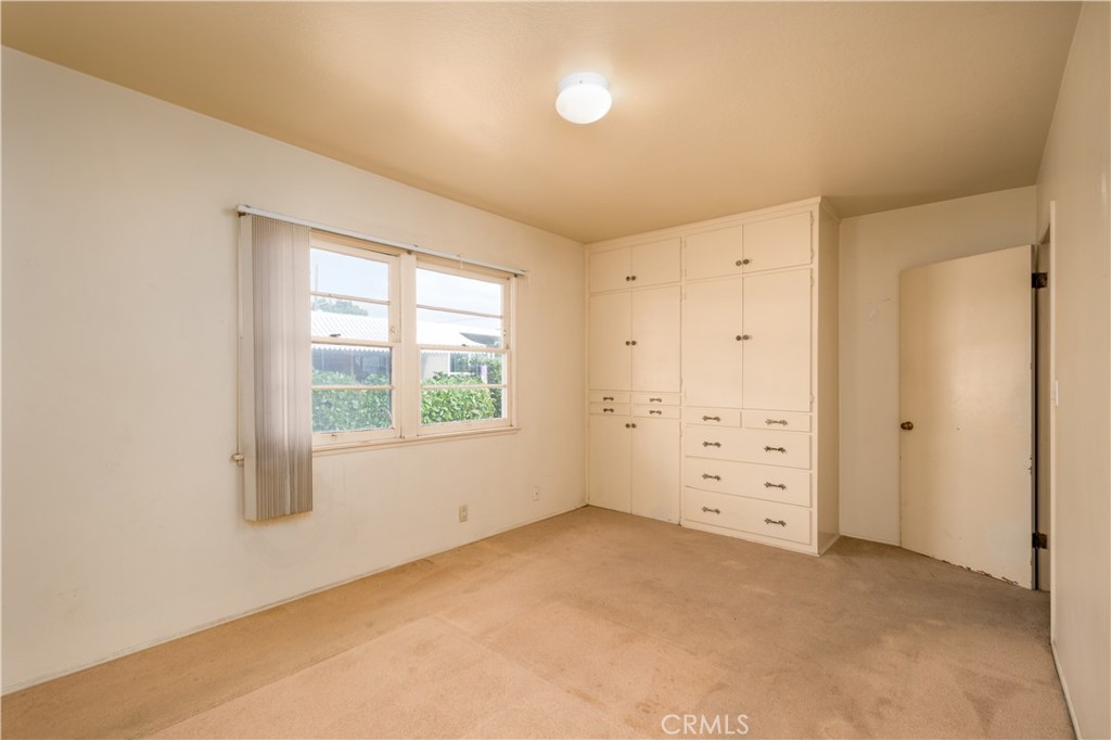 12817 Beverly Boulevard Whittier, CA 90601 - Photo 6 of 30 an empty room with windows and closet