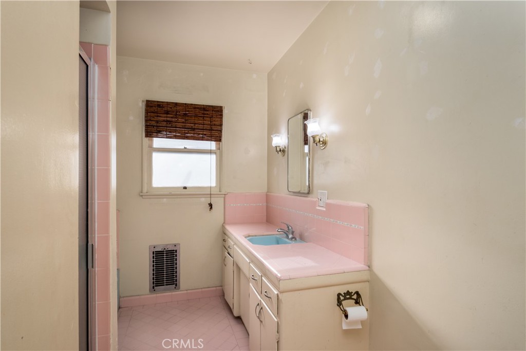 12817 Beverly Boulevard Whittier, CA 90601 - Photo 8 of 30 a bathroom with a sink and a mirror