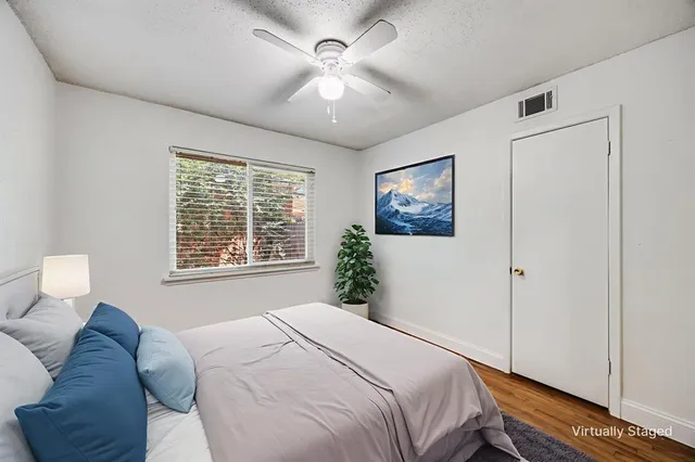 a bedroom with a bed and a window