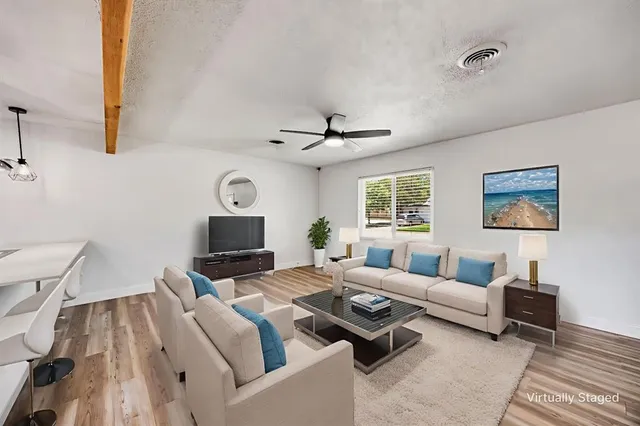 a living room with furniture and a window