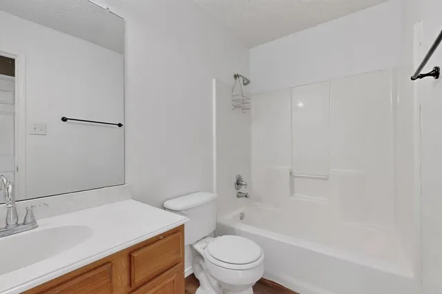 a bathroom with a sink a toilet and a bathtub