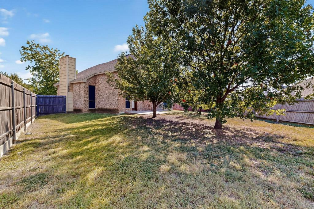 137 Walnut Lane Rockwall, TX 75032 - Photo 36 of 40 a view of a house with a yard