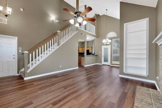 a view of an entryway with wooden floor