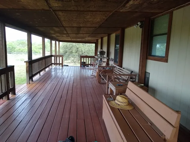 a view of balcony with wooden floor