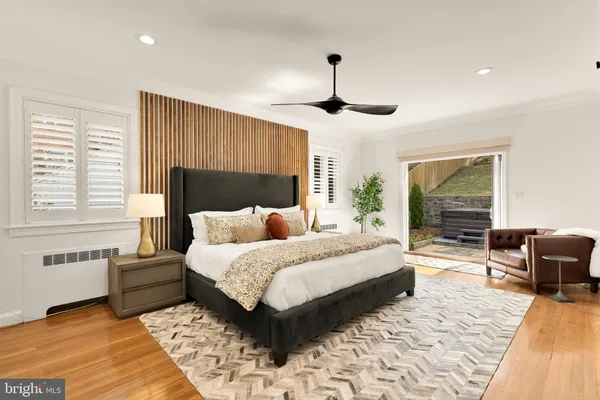 a living room with furniture a flat screen tv and a stove