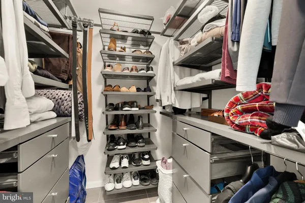 a view of walk in closet and bathroom