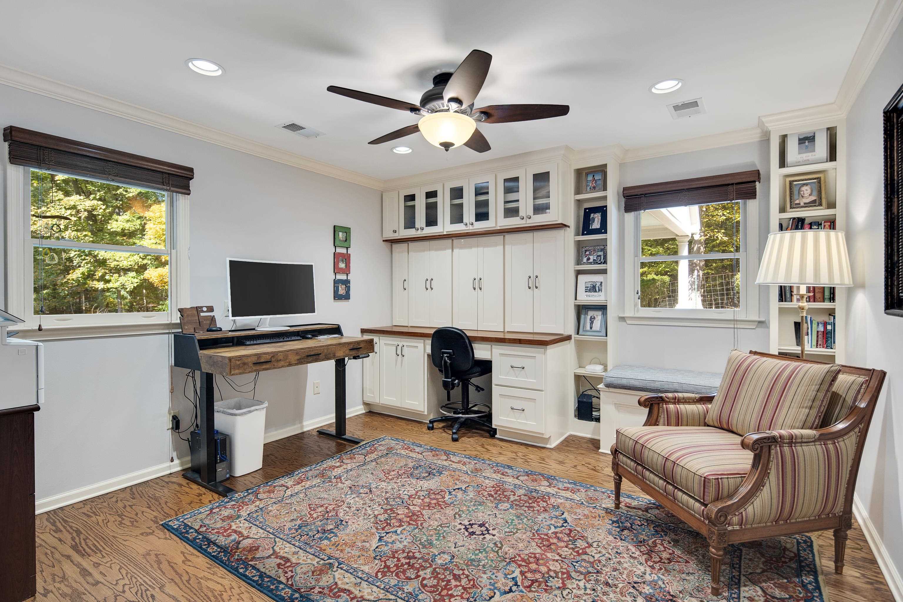 415 Wiseman Road Eads, TN 38028 - Photo 17 of 40 Home office featuring built in desk, crown molding, hardwood / wood-style flooring, and plenty of natural light