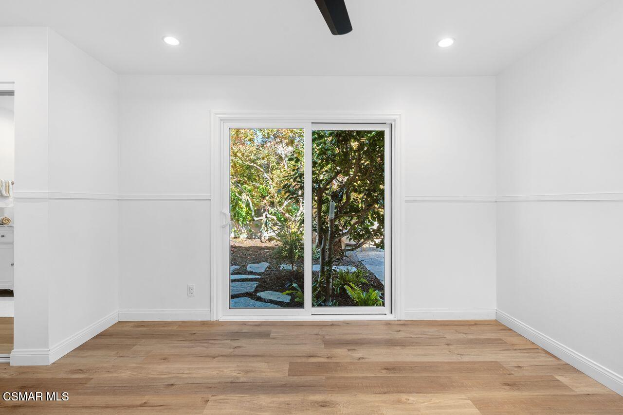 3359 Ridden Street Camarillo, CA 93010 - Photo 19 of 30 a view of an empty room with wooden floor and a window