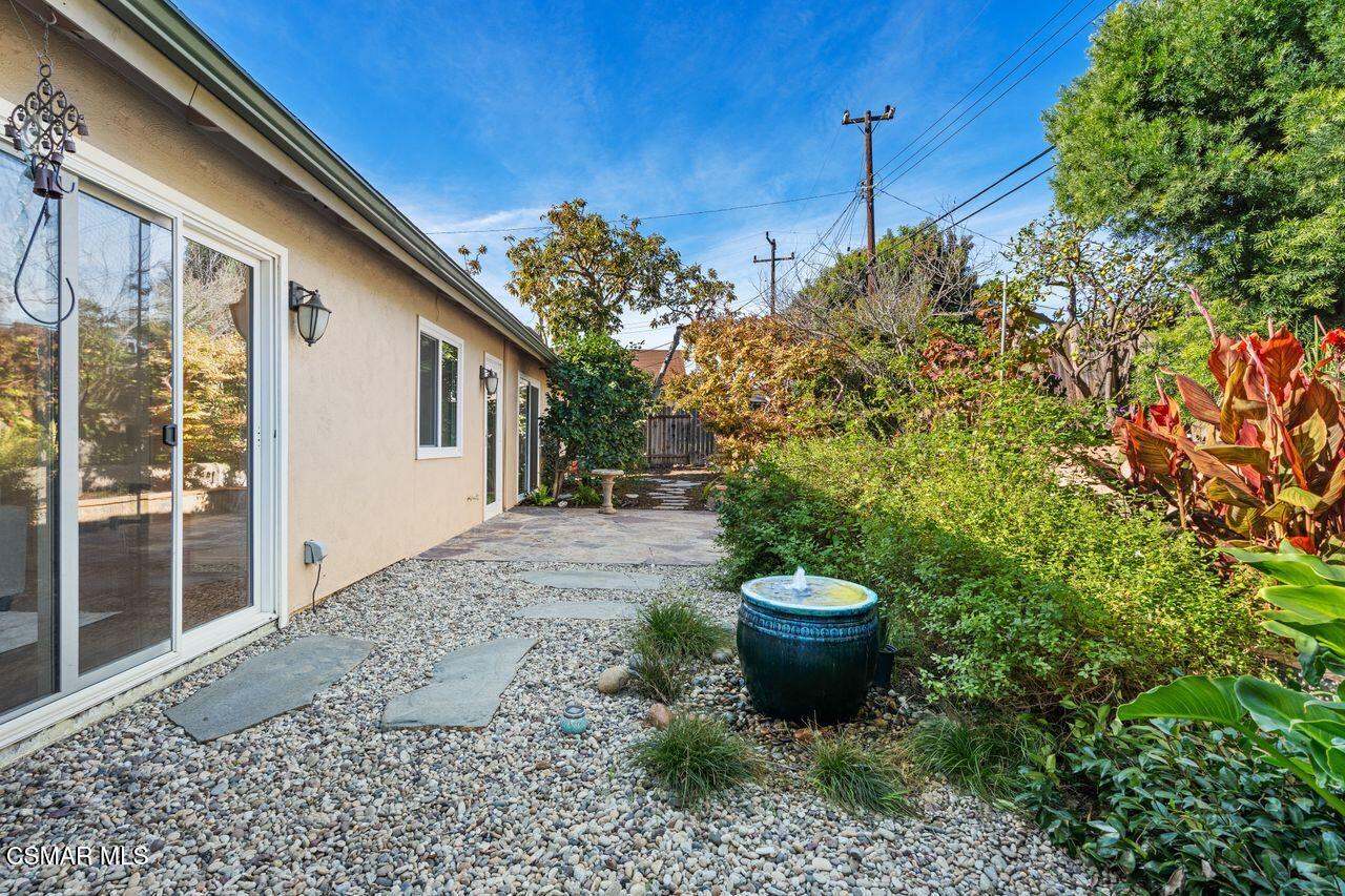 3359 Ridden Street Camarillo, CA 93010 - Photo 22 of 30 a view of a backyard with plants and a fountain