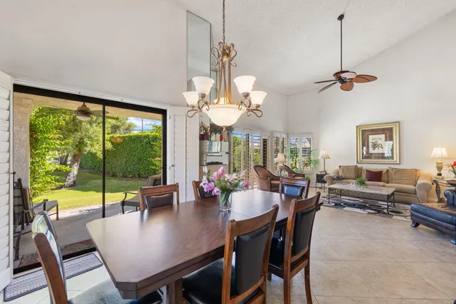 a kitchen with kitchen island granite countertop a sink cabinets and stainless steel appliances
