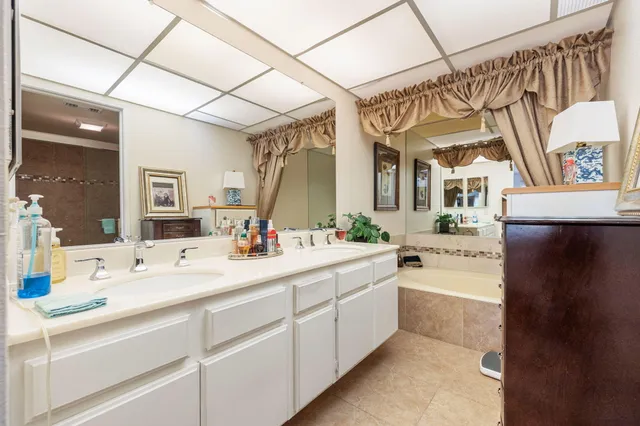 a bedroom with a bed window and a couch