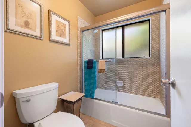 a bedroom with a large bed and a dresser