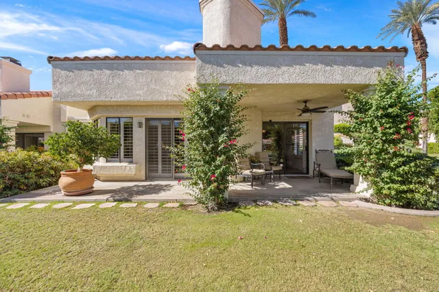 a view of a swimming pool with a table and chairs