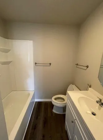 a bathroom with a sink and toilet