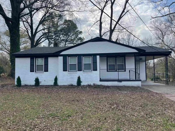 a house with trees in the background