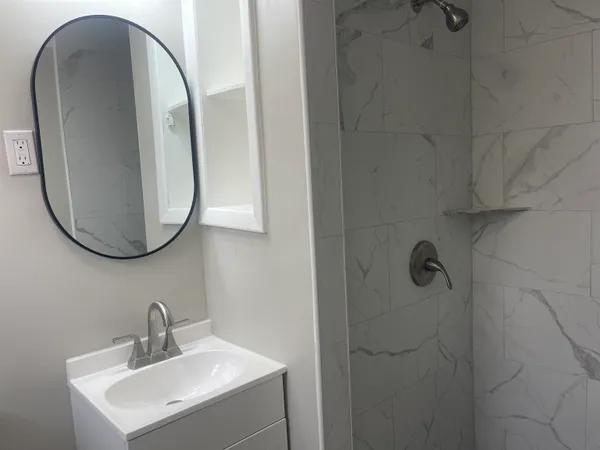 a bathroom with a sink and mirror