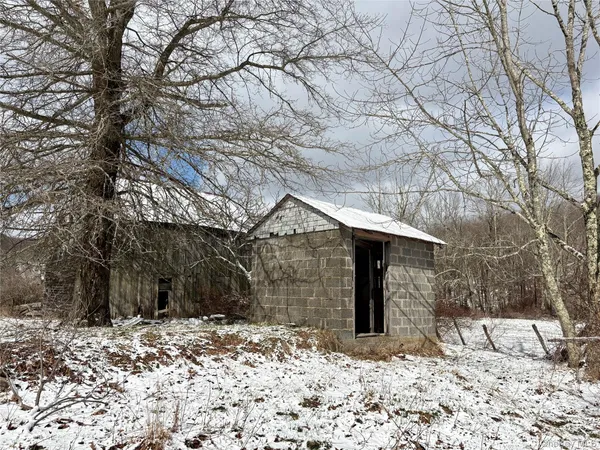 a view of roof with wooden fence