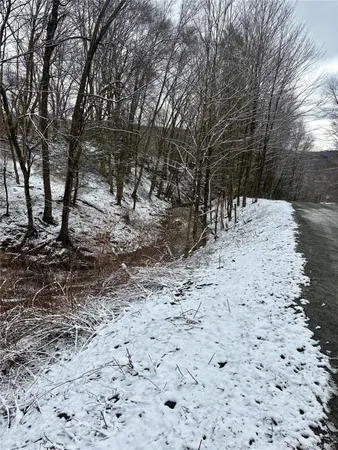 a view of a yard covered with snow