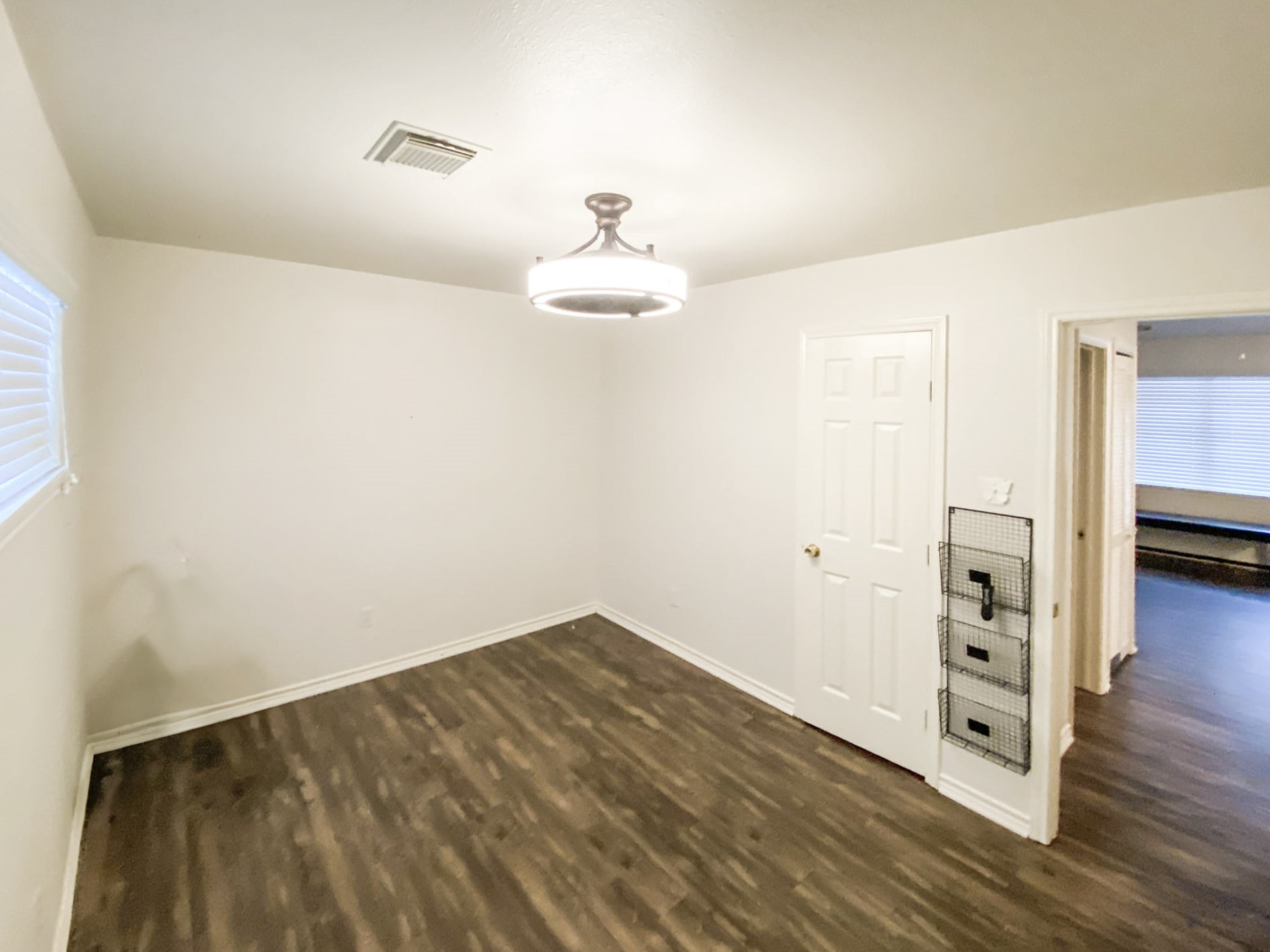 5006 Maxie Street Houston, TX 77007 - Photo 22 of 23 a view of empty room with wooden floor