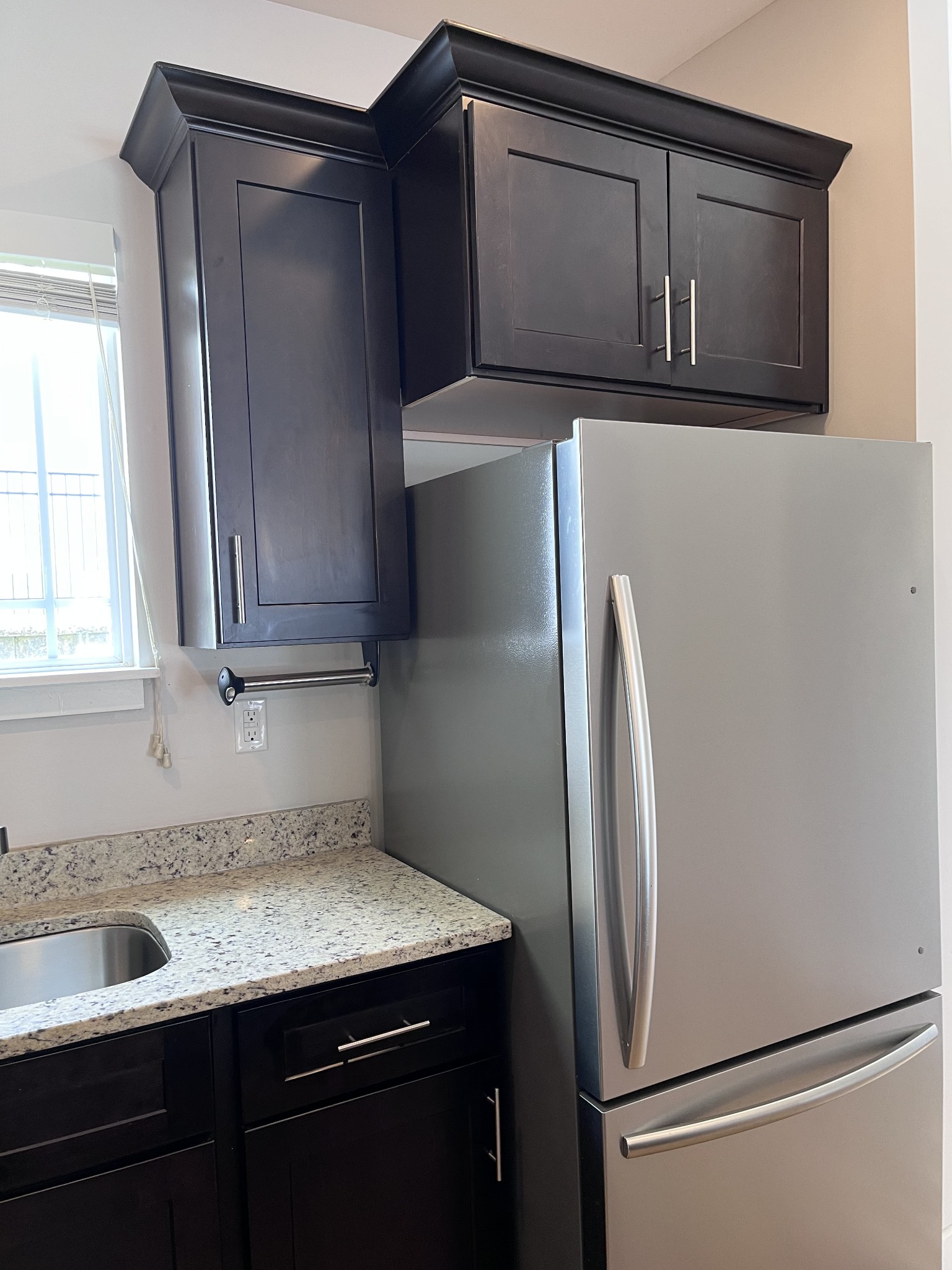 8011 Tuberose Court Spring Hill, TN 37174 - Photo 6 of 20 a kitchen with a refrigerator and cabinets