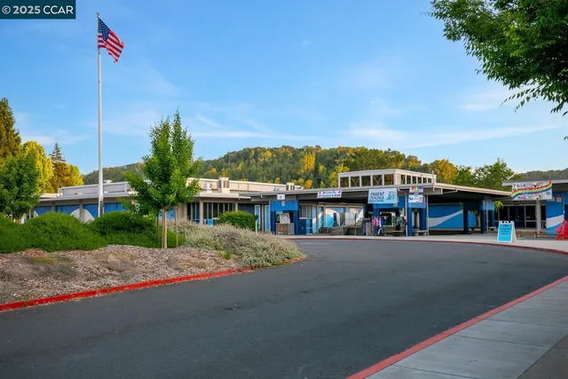 a view of a store with a table and chairs