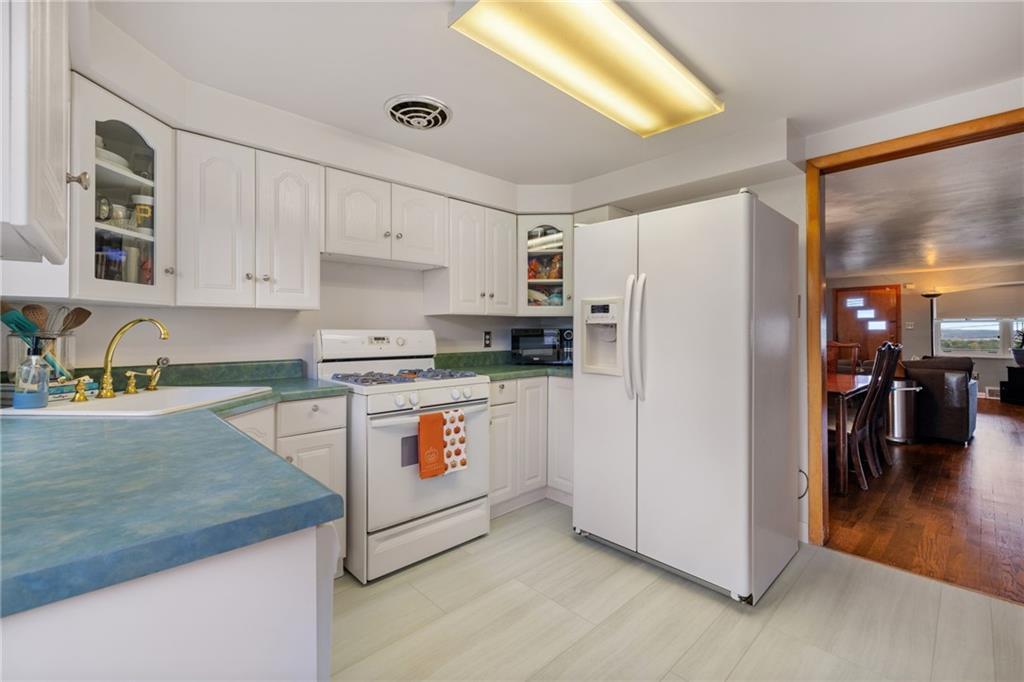 508 Montclair Street Pittsburgh, PA 15217 - Photo 11 of 29 a kitchen with stainless steel appliances granite countertop a refrigerator a stove and a sink