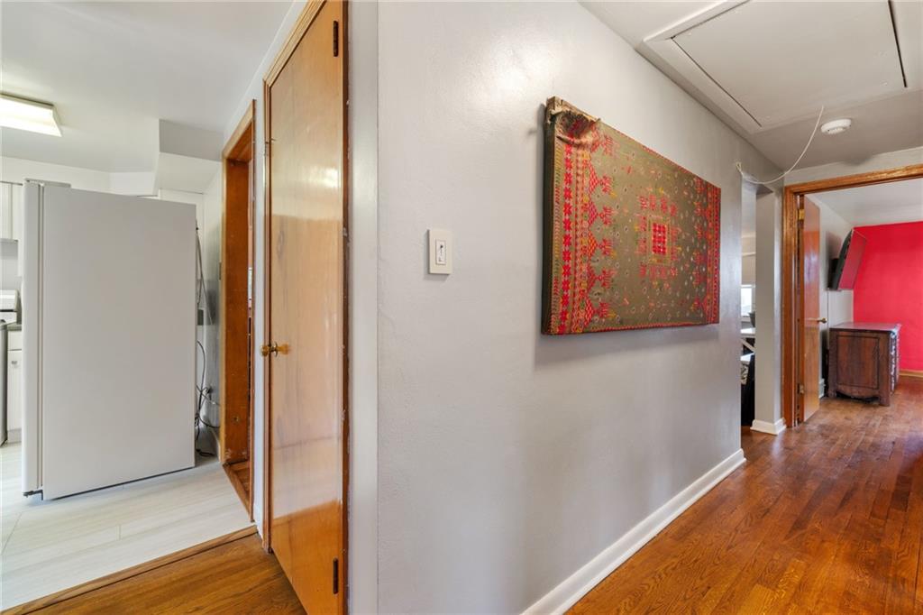 508 Montclair Street Pittsburgh, PA 15217 - Photo 12 of 29 a view of a hallway with wooden floor and stairs