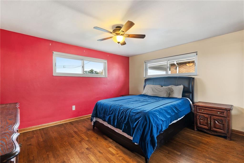 508 Montclair Street Pittsburgh, PA 15217 - Photo 13 of 29 a bedroom with a bed and a chandelier