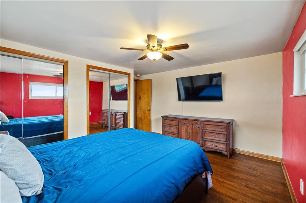 508 Montclair Street Pittsburgh, PA 15217 - Photo 14 of 29 a bedroom with a bed and a dresser with wooden floor