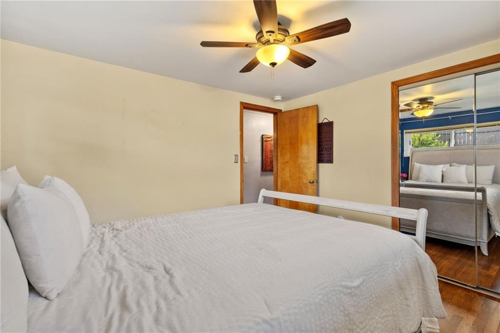 508 Montclair Street Pittsburgh, PA 15217 - Photo 19 of 29 a bedroom with a large bed and a chandelier