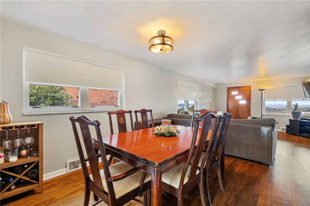 508 Montclair Street Pittsburgh, PA 15217 - Photo 9 of 29 a dining room with furniture a rug and a chandelier
