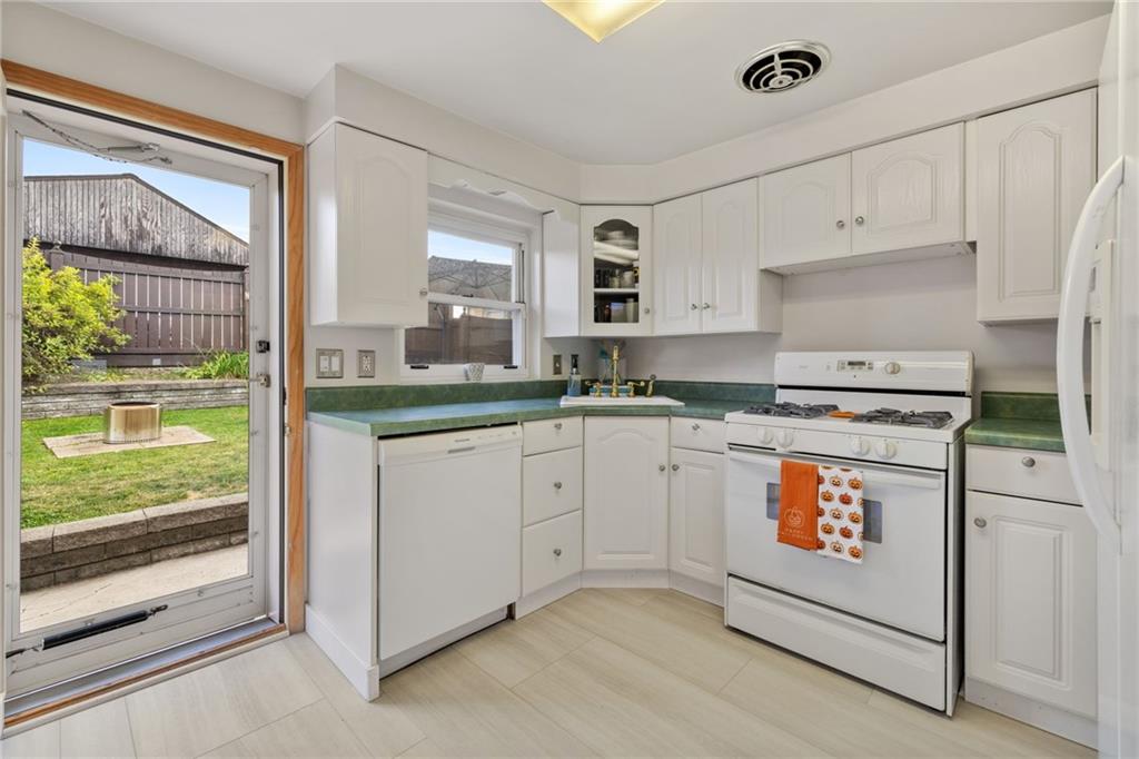 508 Montclair Street Pittsburgh, PA 15217 - Photo 10 of 29 a kitchen with granite countertop white cabinets and white appliances