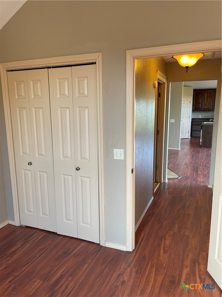 234 Star Grass, Unit 2B Spring Branch, TX 78070 - Photo 26 of 30 a view of a hallway with wooden floor