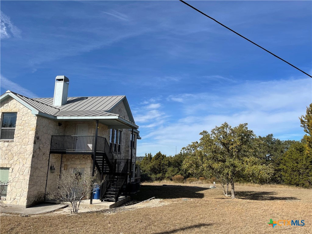 234 Star Grass, Unit 2B Spring Branch, TX 78070 - Photo 6 of 30 a front view of a house with a yard