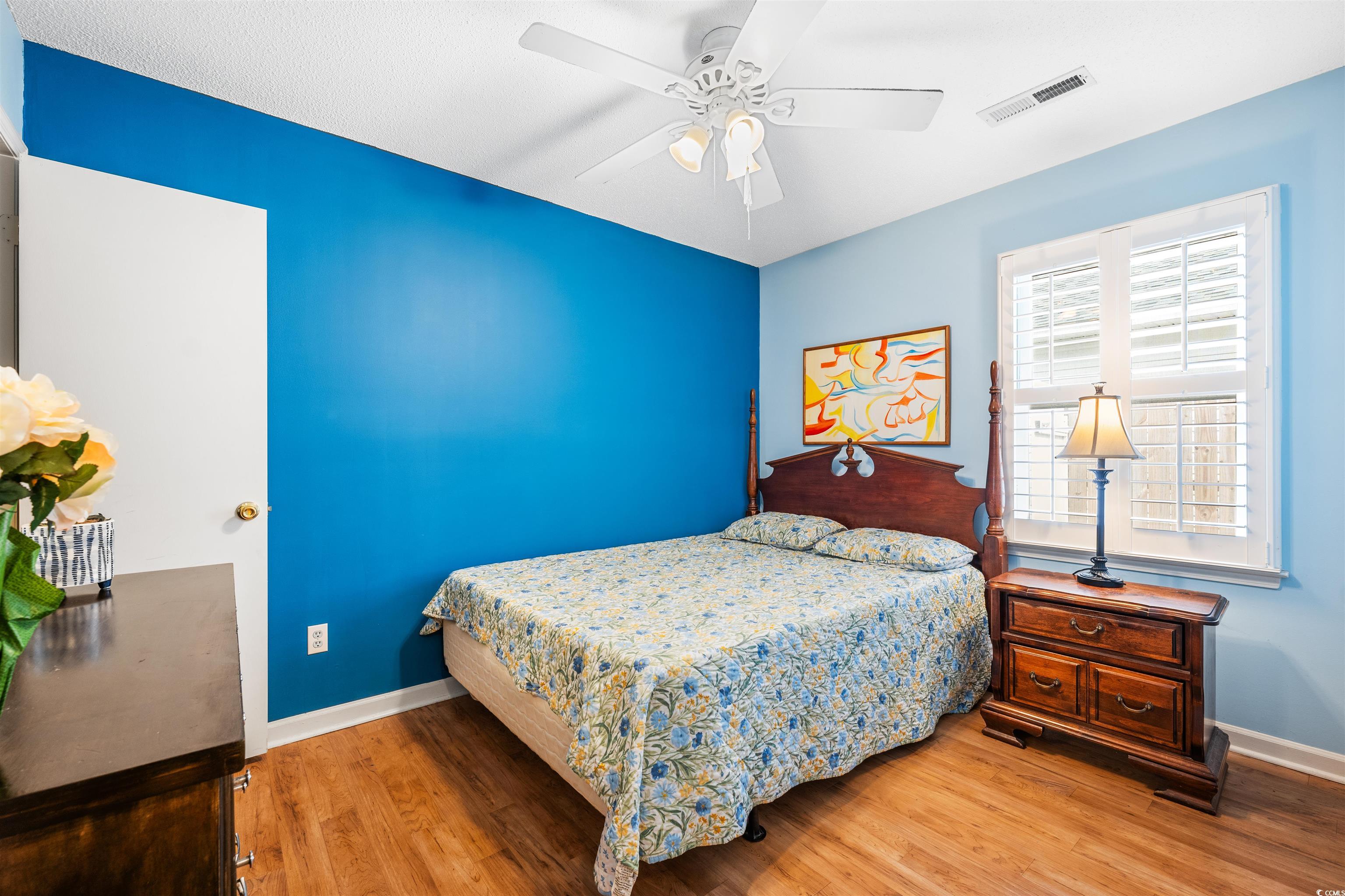 1644 Stuart Square Circle Myrtle Beach, SC 29577 - Photo 16 of 21 Bedroom with hardwood / wood-style flooring and ceiling fan