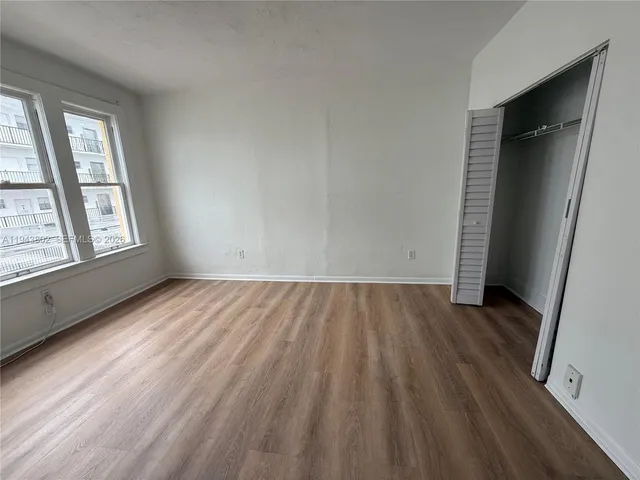 a kitchen with a stove a sink and a window
