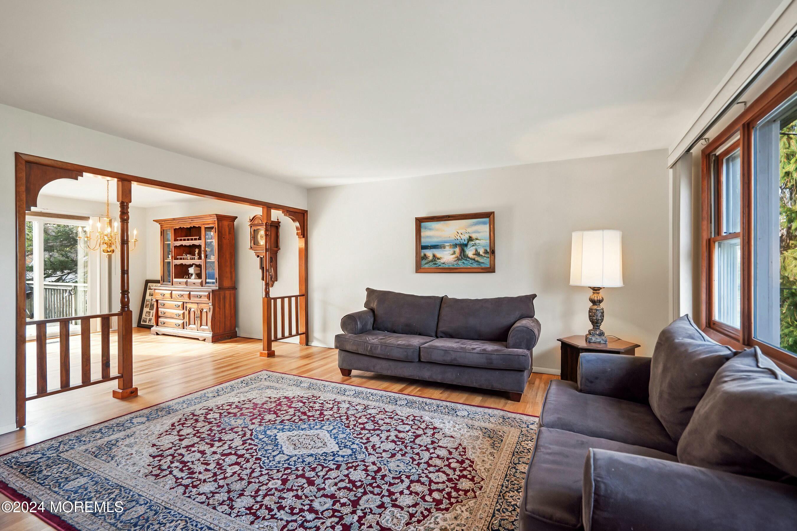 1107 Manito Road Manasquan, NJ 08736 - Photo 3 of 27 a living room with furniture and a rug