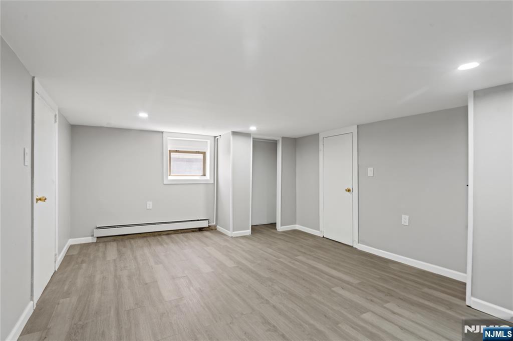 190 Washington Avenue Hackensack, NJ 07601 - Photo 11 of 20 a view of an empty room with wooden floor and a window
