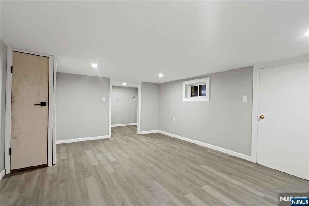 190 Washington Avenue Hackensack, NJ 07601 - Photo 12 of 20 a view of an empty room with wooden floor and closet