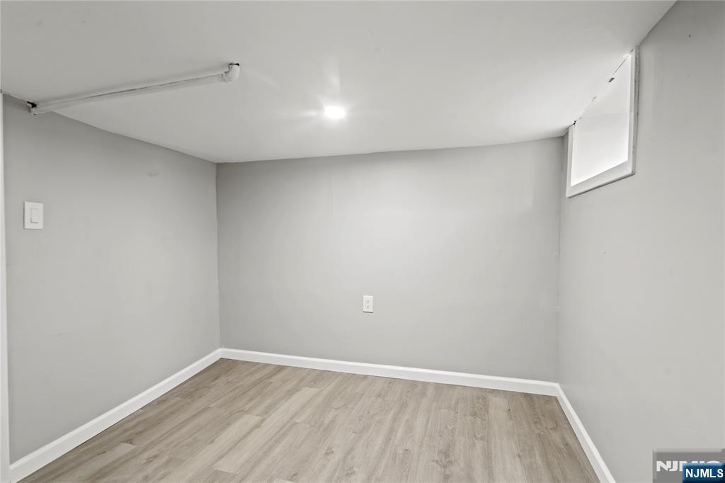 190 Washington Avenue Hackensack, NJ 07601 - Photo 13 of 20 a view of an empty room with wooden floor