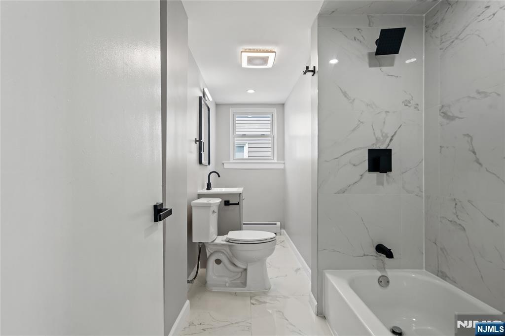 190 Washington Avenue Hackensack, NJ 07601 - Photo 2 of 20 a bathroom with a bathtub toilet and sink
