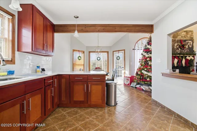 a kitchen with stainless steel appliances granite countertop a sink cabinets and wooden floor