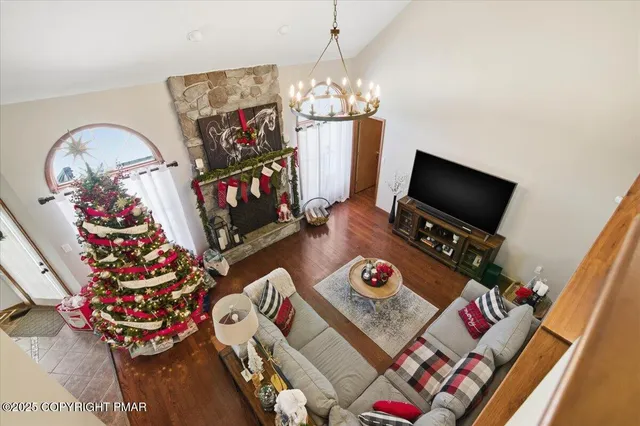a living room with furniture and a flat screen tv