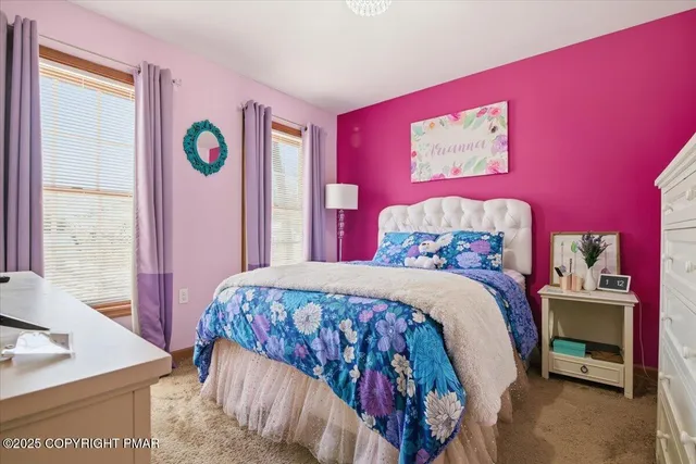 a bedroom with a bed and a table