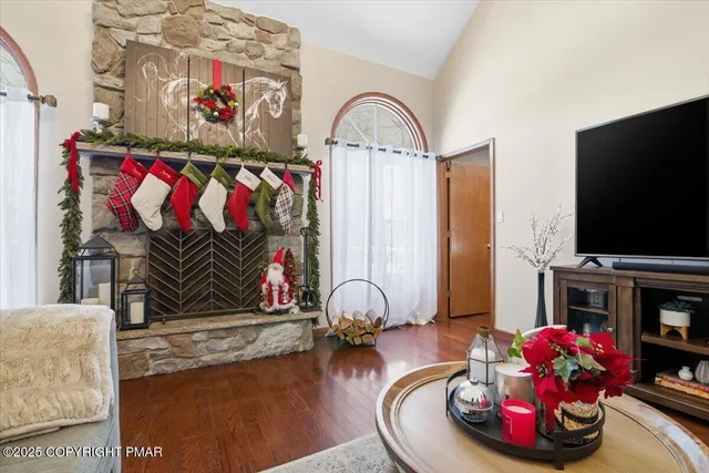 a living room with furniture and a flat screen tv