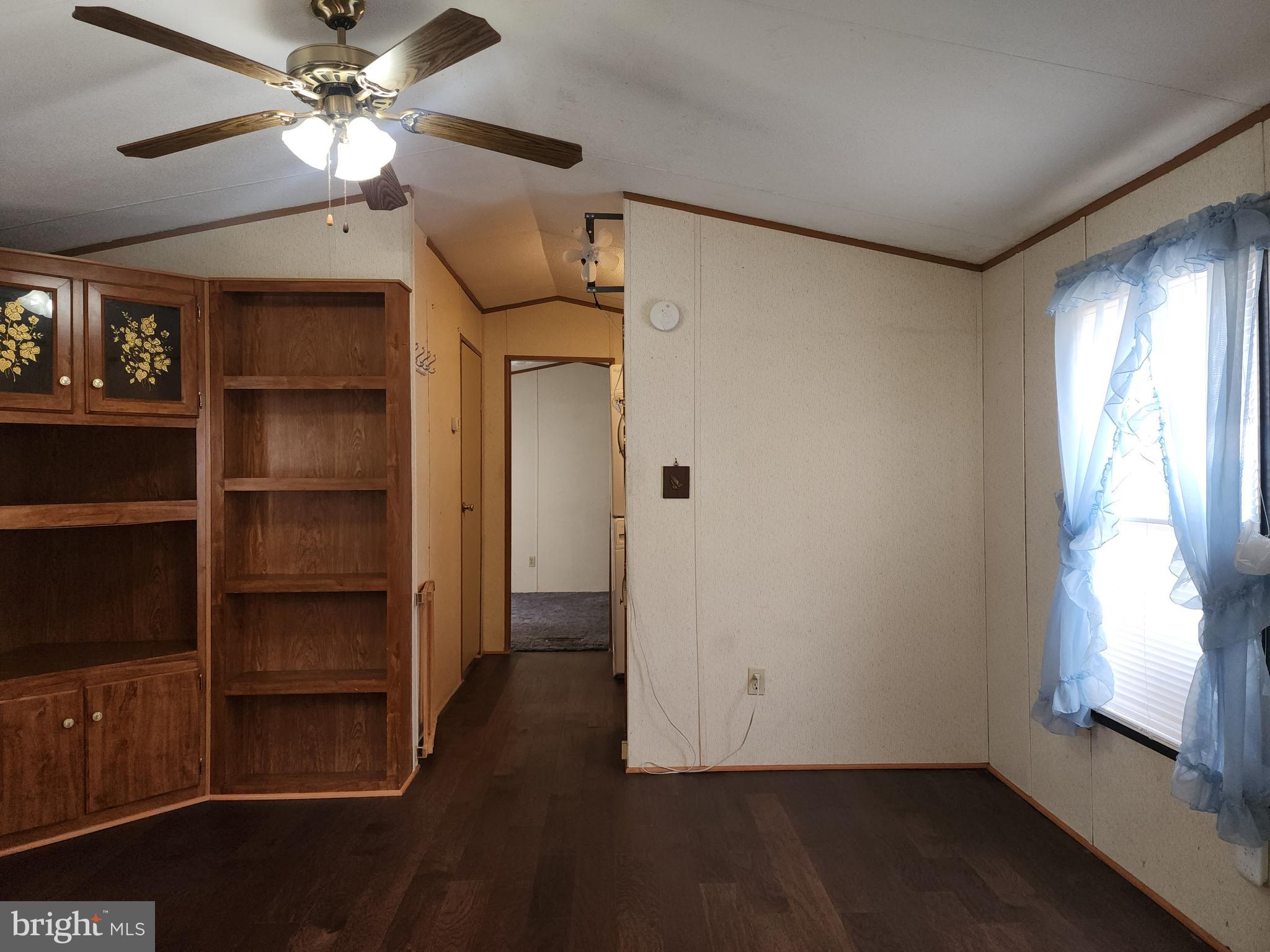 109 Neil Road Shippensburg, PA 17257 - Photo 17 of 62 a view of an empty room with a window and wooden floor