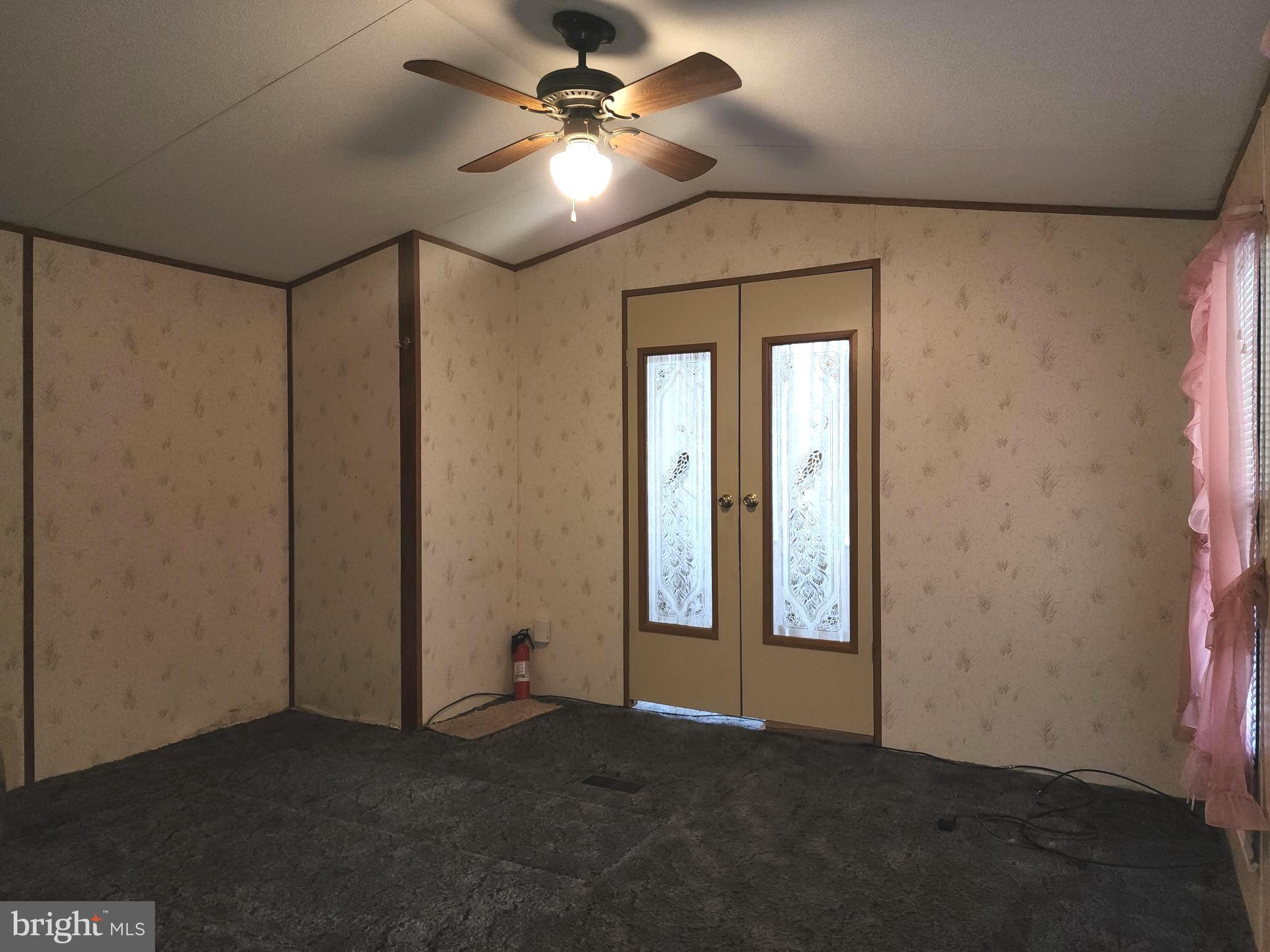 109 Neil Road Shippensburg, PA 17257 - Photo 28 of 62 an empty room with windows and fan