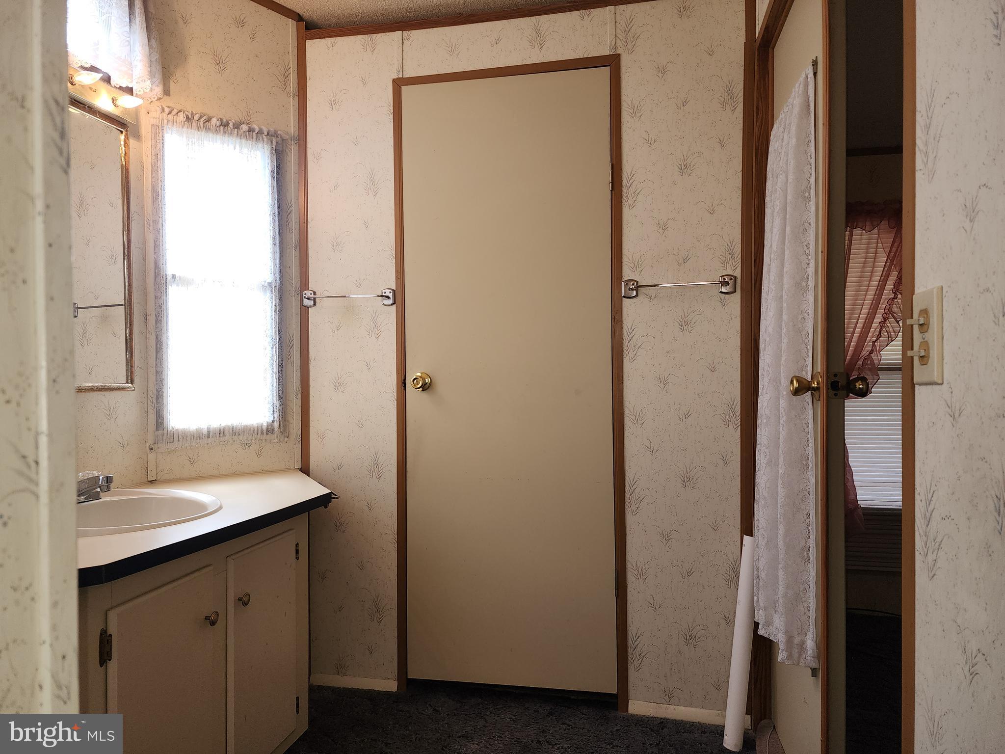 109 Neil Road Shippensburg, PA 17257 - Photo 29 of 62 a bathroom with a sink a mirror and shower