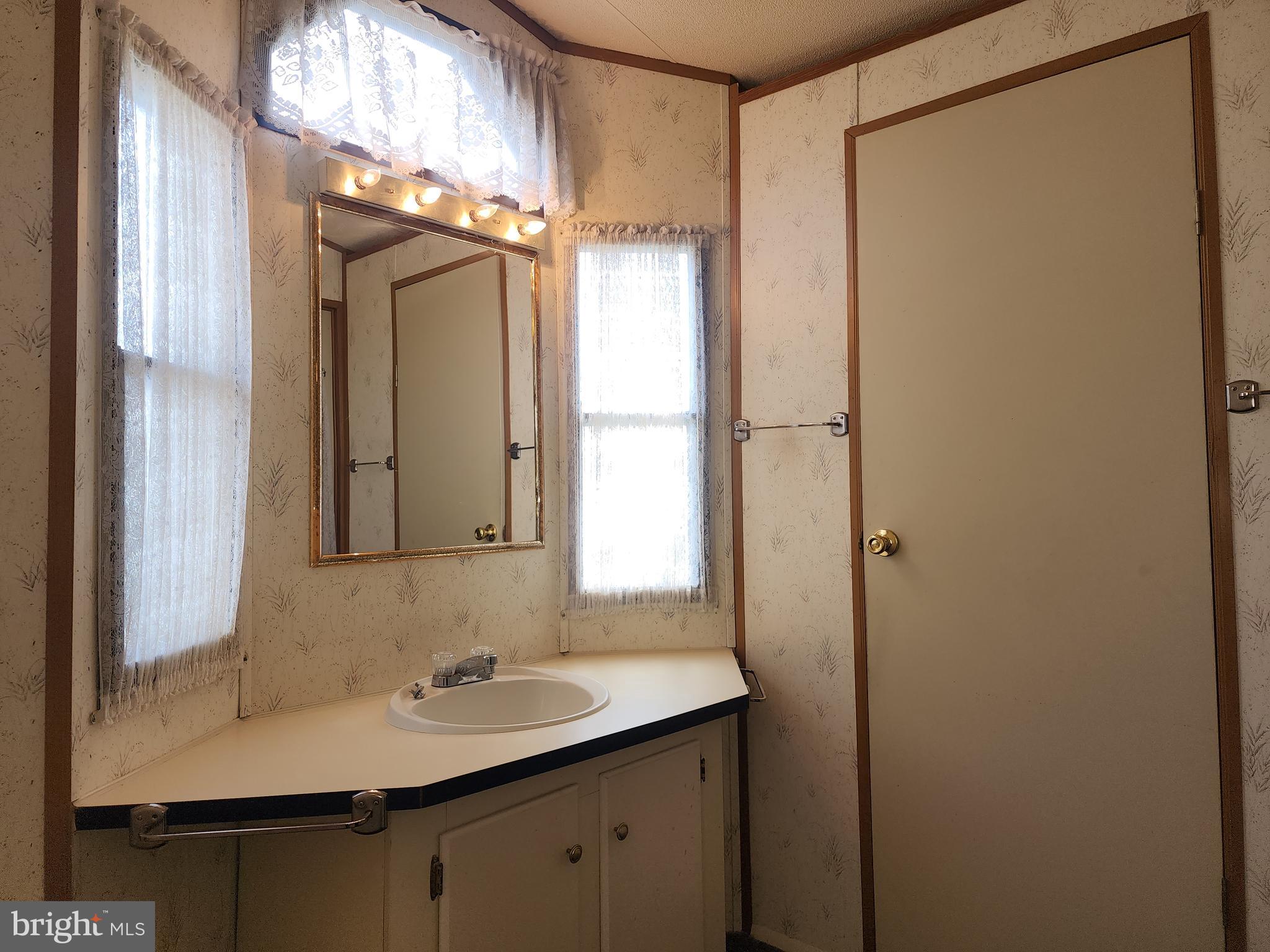 109 Neil Road Shippensburg, PA 17257 - Photo 30 of 62 a bathroom with a sink and a mirror
